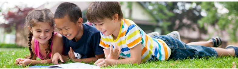 Kids Reading on Lawn